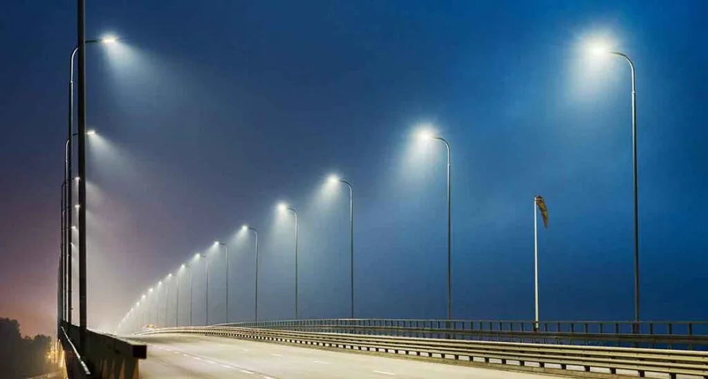 Image Placeholder: Highway at night illuminated by galvanized poles