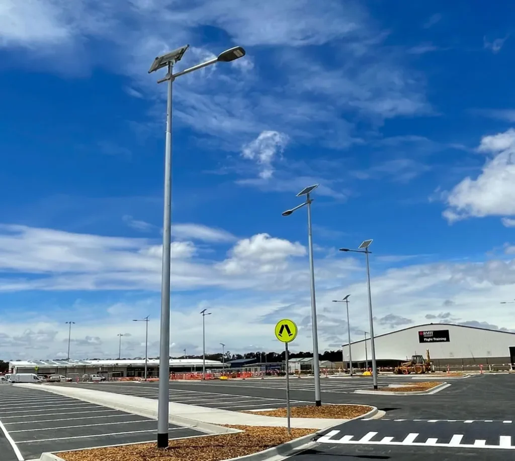 Contractor checking anchor bolt template level for solar street light foundation