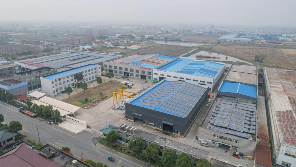 Factory aerial view showing rooftop solar workshops and outdoor lighting production areas